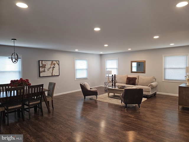 living room with dark hardwood / wood-style flooring