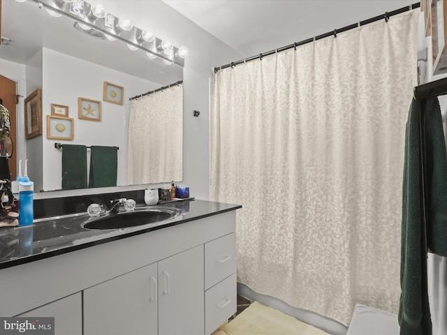 bathroom with vanity and a shower with curtain