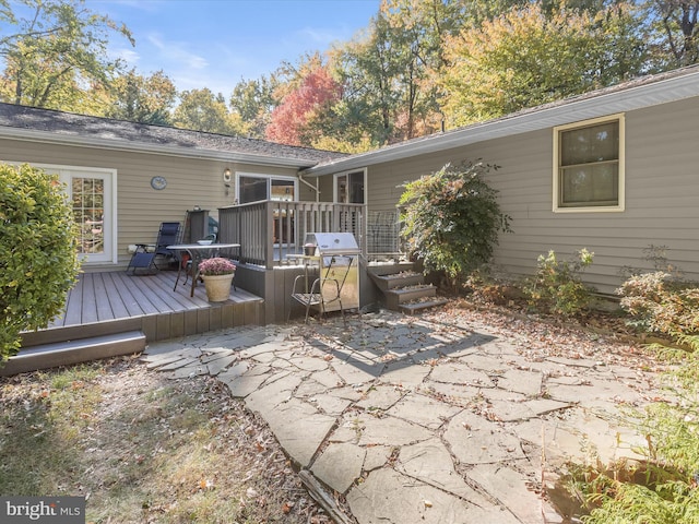 back of property with a patio and a deck