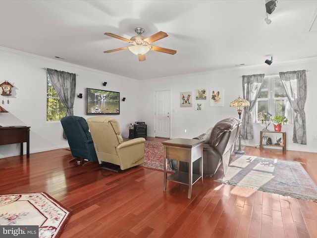 living room with hardwood / wood-style flooring, a healthy amount of sunlight, and ceiling fan