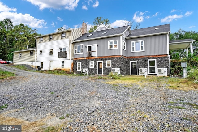 back of house featuring ac unit