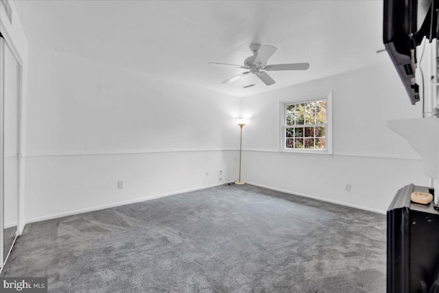 interior space featuring ceiling fan and carpet floors