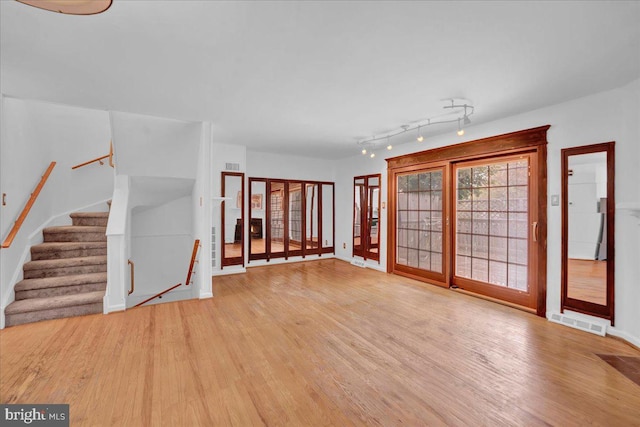 unfurnished room featuring hardwood / wood-style flooring