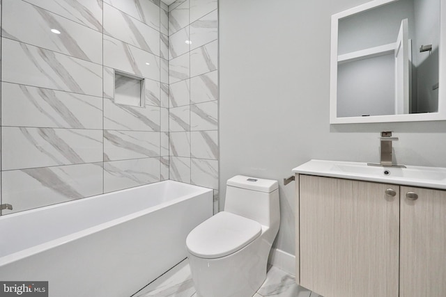 full bathroom with tiled shower / bath, vanity, and toilet