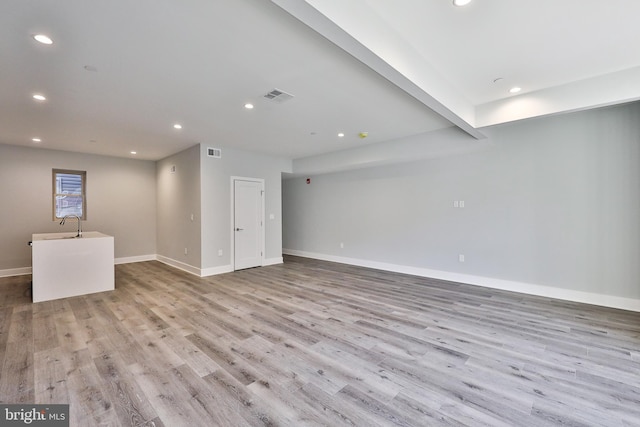 spare room with light hardwood / wood-style flooring