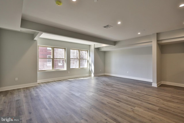 unfurnished living room with dark hardwood / wood-style flooring