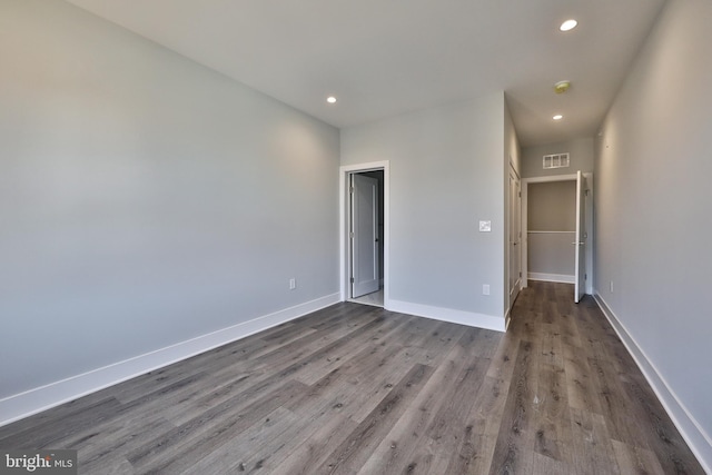 unfurnished bedroom with hardwood / wood-style floors