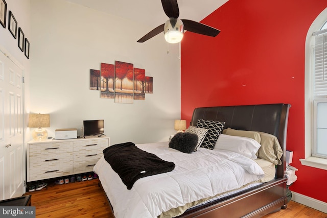 bedroom featuring dark hardwood / wood-style floors and ceiling fan