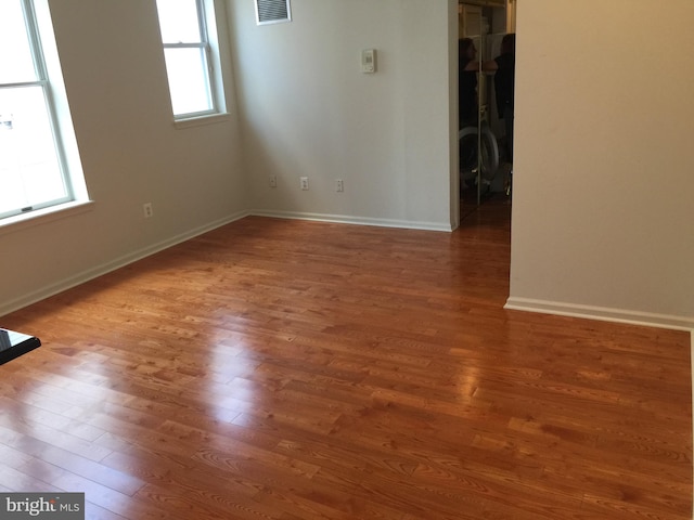 unfurnished room featuring wood-type flooring