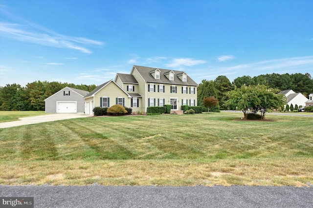 view of front facade featuring a front yard and a garage