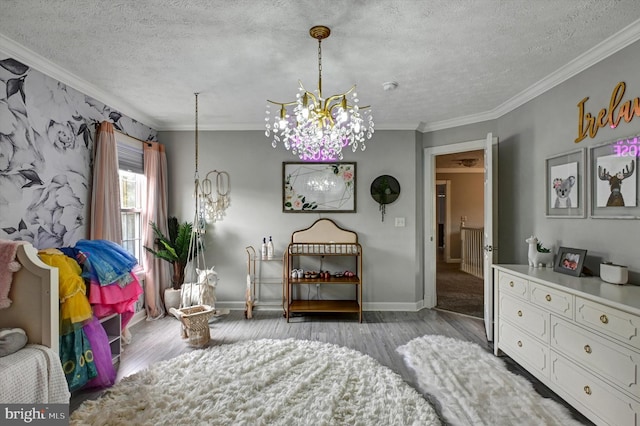 bedroom featuring a chandelier, crown molding, a textured ceiling, and light wood-type flooring