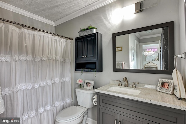 bathroom featuring toilet, a textured ceiling, vanity, and ornamental molding