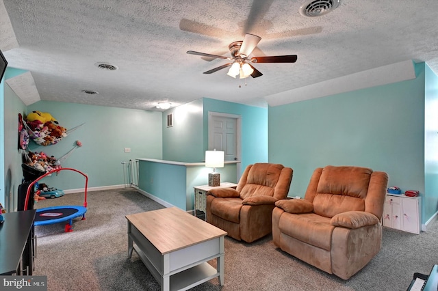 carpeted living room with ceiling fan, a textured ceiling, and vaulted ceiling