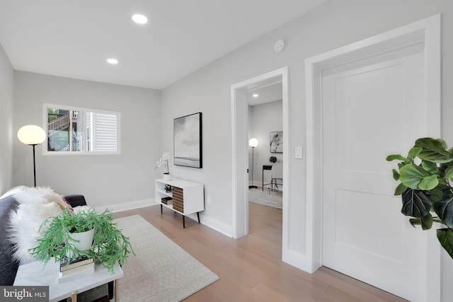 living area with light hardwood / wood-style flooring