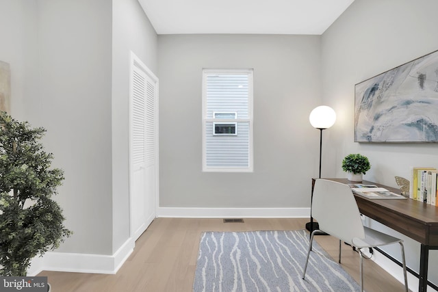 home office featuring light hardwood / wood-style floors