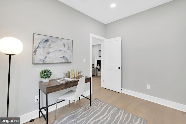 office area with light hardwood / wood-style flooring