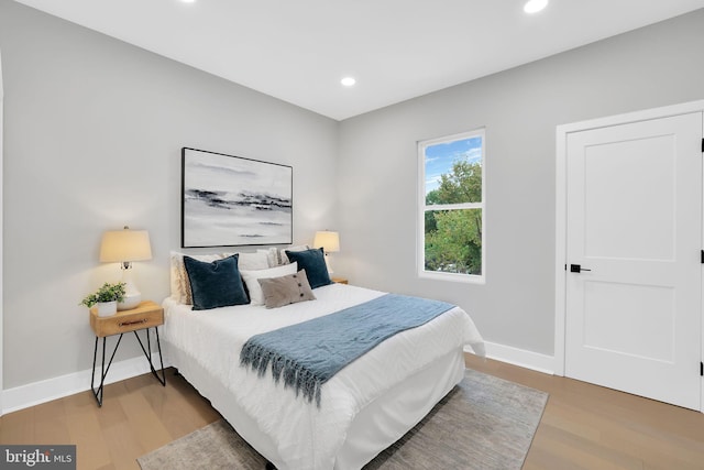 bedroom with wood-type flooring