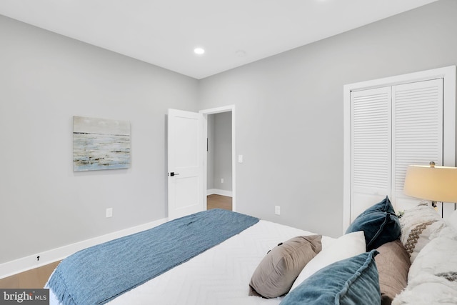 bedroom featuring a closet and hardwood / wood-style floors