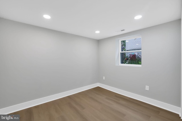 spare room with hardwood / wood-style floors