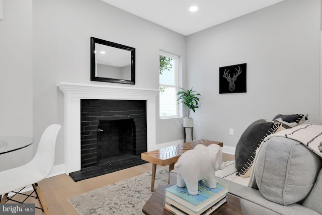 living room featuring a fireplace and hardwood / wood-style floors