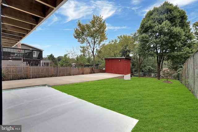 view of yard with a patio and a shed