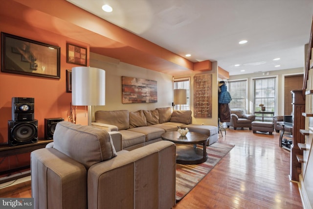 living room with light hardwood / wood-style flooring and a fireplace