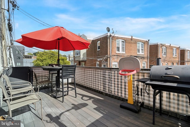 wooden deck with grilling area