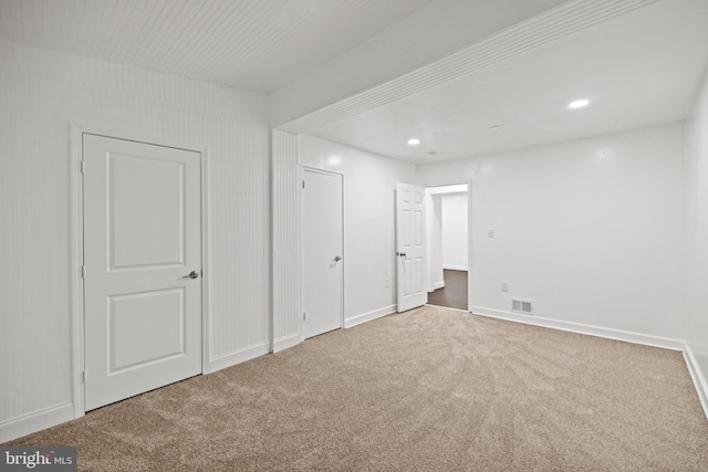 unfurnished bedroom featuring carpet flooring