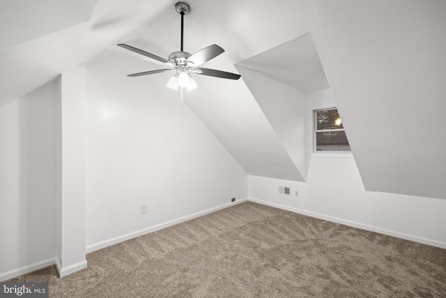 additional living space with lofted ceiling, carpet flooring, and ceiling fan