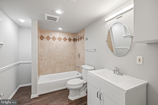 7213 Tyler Ave, Falls Church, VA 22042 - full bath featuring toilet, wood finished floors, bathtub / shower combination, visible vents, and vanity
