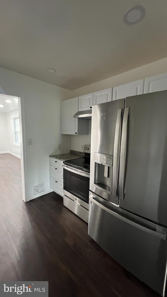 kitchen featuring dark hardwood / wood-style flooring, white cabinetry, and appliances with stainless steel finishes