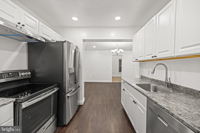 kitchen featuring dark wood-type flooring, sink, a chandelier, white cabinetry, and appliances with stainless steel finishes