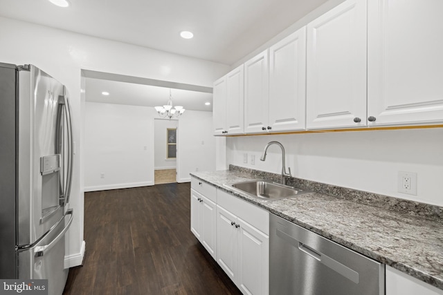 7213 Tyler Ave, Falls Church, VA 22042 - kitchen featuring a sink, an inviting chandelier, stainless steel appliances, and white cabinets