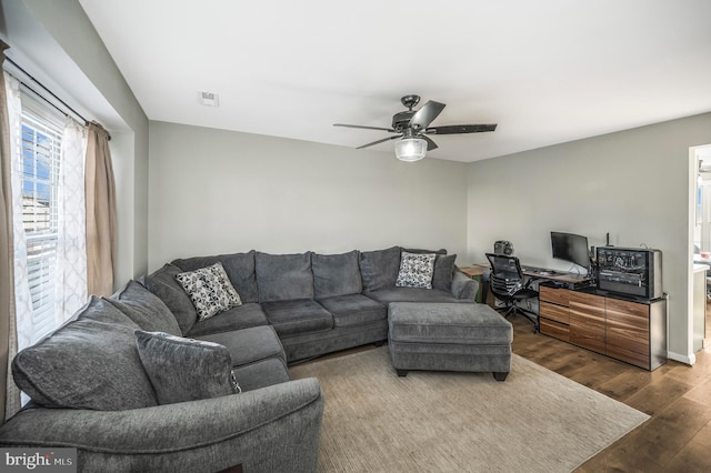 living room with hardwood / wood-style floors and ceiling fan