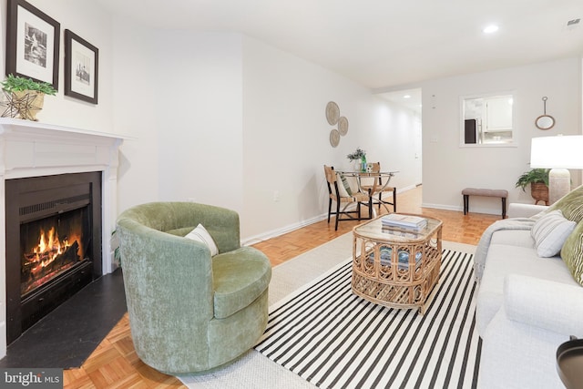 living room featuring light parquet floors