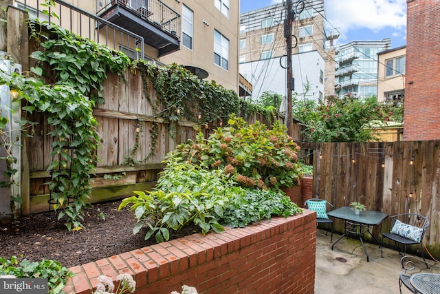 view of patio featuring a balcony