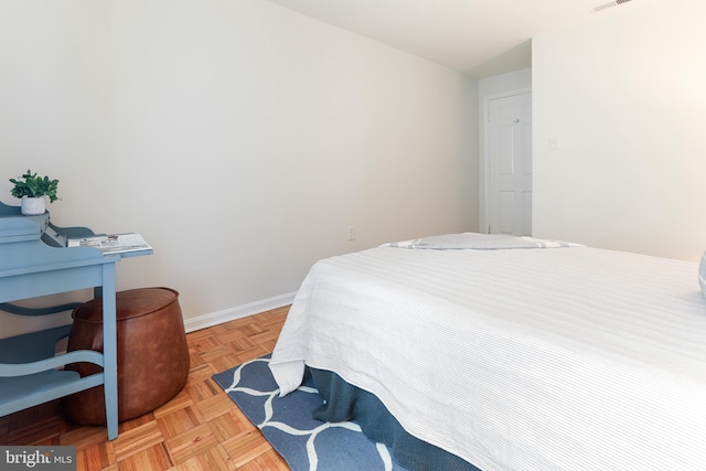 bedroom featuring light parquet flooring