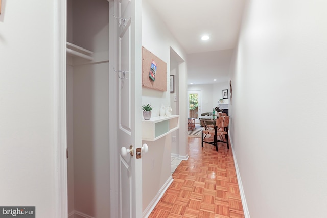 corridor featuring light parquet flooring