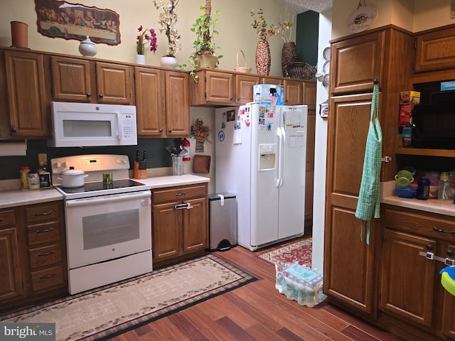 kitchen with light wood-type flooring and white appliances