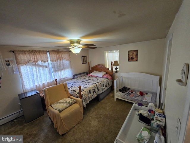 carpeted bedroom with multiple windows, a baseboard heating unit, and ceiling fan