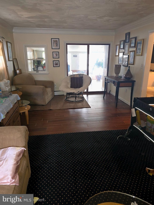 living room featuring a textured ceiling, hardwood / wood-style flooring, crown molding, and a baseboard heating unit