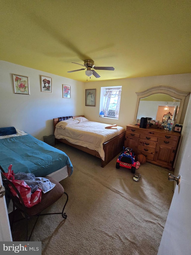 carpeted bedroom featuring ceiling fan