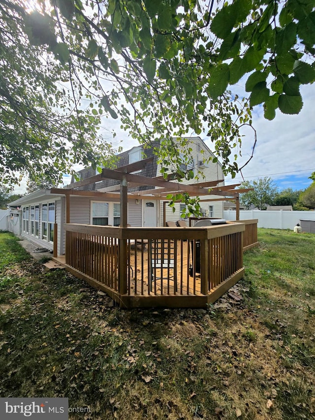 back of house featuring a wooden deck