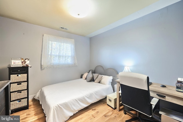 bedroom with light hardwood / wood-style floors