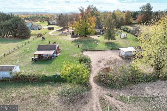 birds eye view of property featuring a rural view