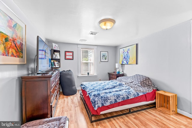 bedroom with light hardwood / wood-style floors