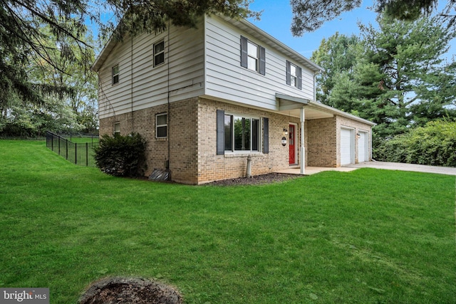 front of property featuring a garage and a front yard