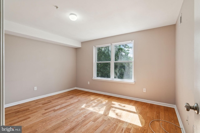 unfurnished room featuring light hardwood / wood-style floors