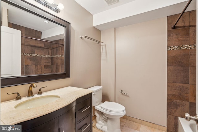 full bathroom with vanity, toilet, and tiled shower / bath