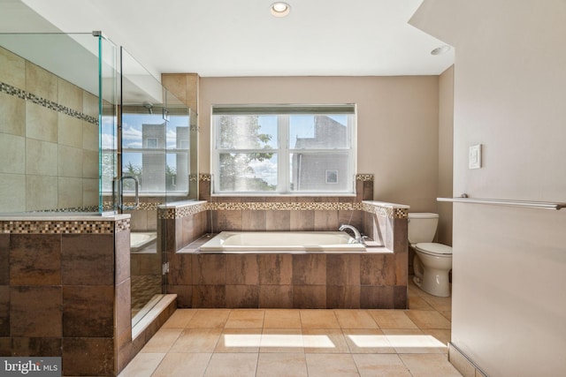 bathroom with toilet, separate shower and tub, and tile patterned flooring